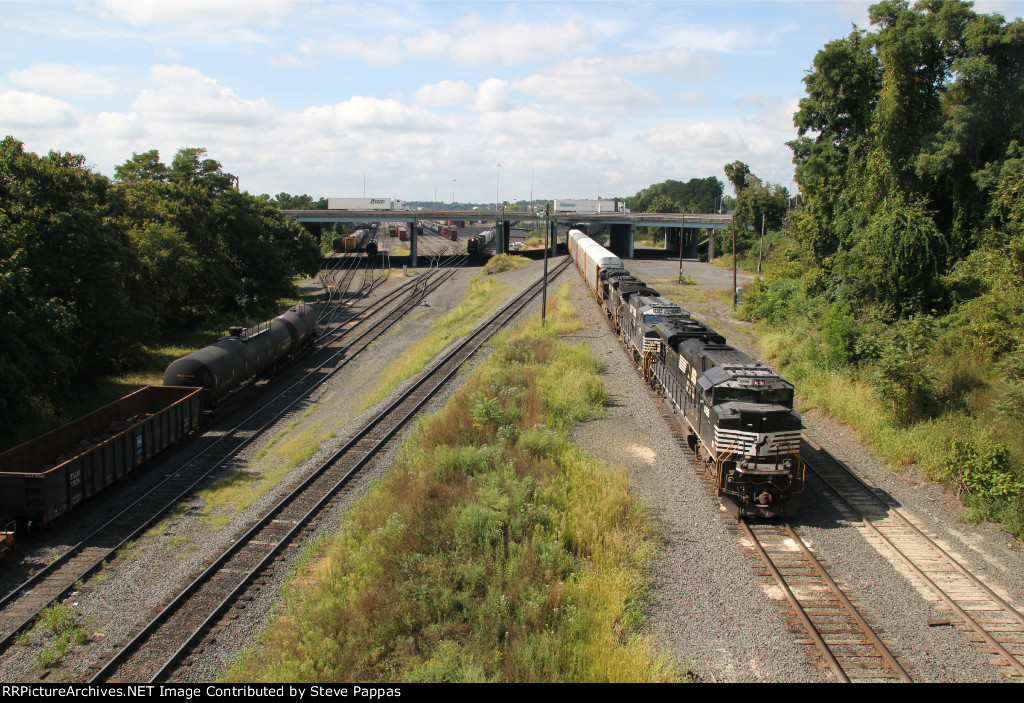 NS 1098 leads 6600 foot train 18N out of Enola yard